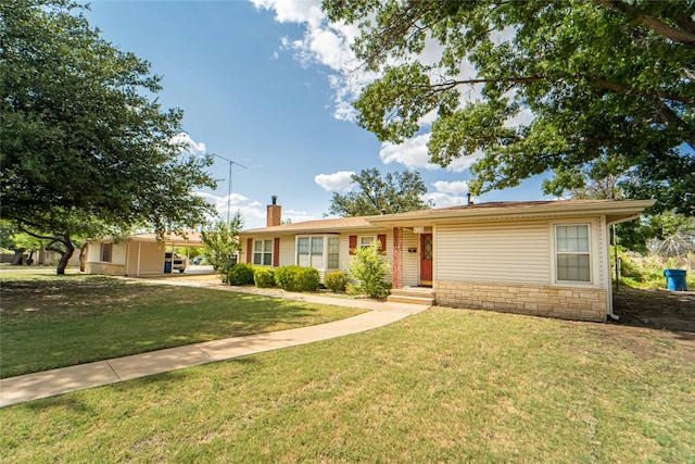 ranch-style home with a front lawn