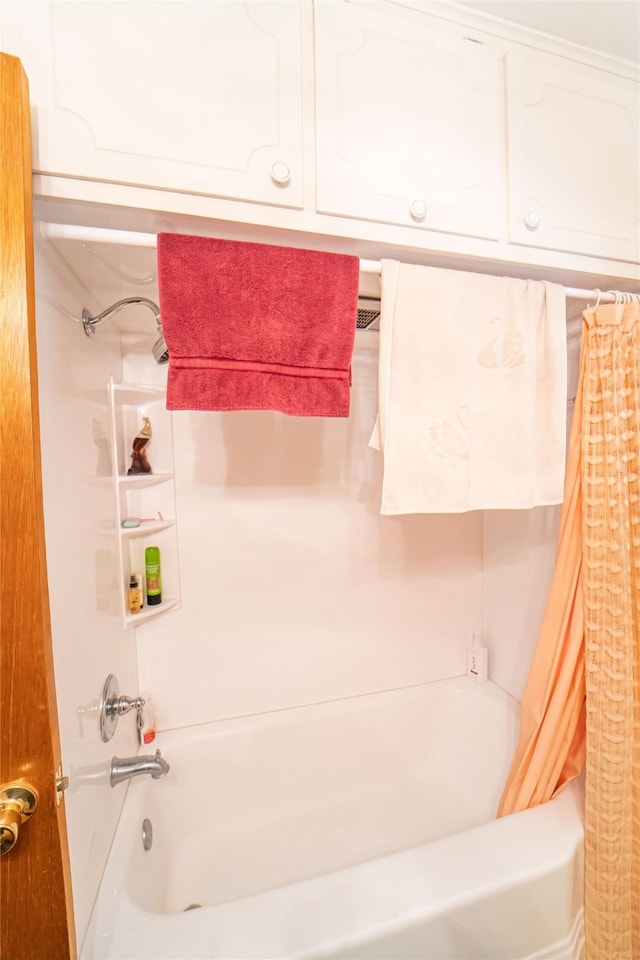 bathroom featuring shower / tub combo with curtain