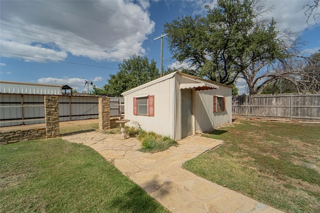 view of outdoor structure with a lawn