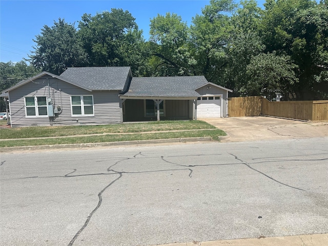 single story home with a front lawn and a garage