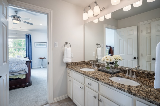 bathroom featuring ceiling fan and vanity