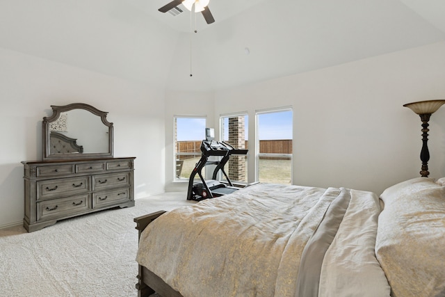 bedroom featuring ceiling fan, lofted ceiling, and light colored carpet