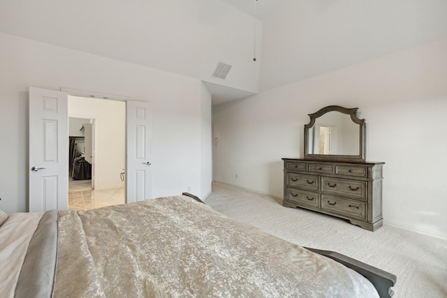 carpeted bedroom with vaulted ceiling