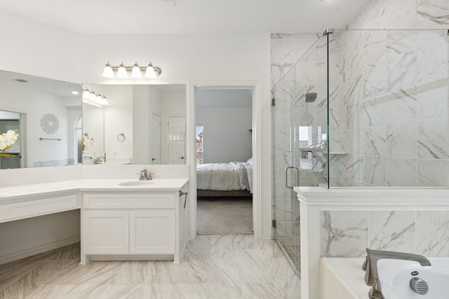 bathroom featuring vanity and independent shower and bath