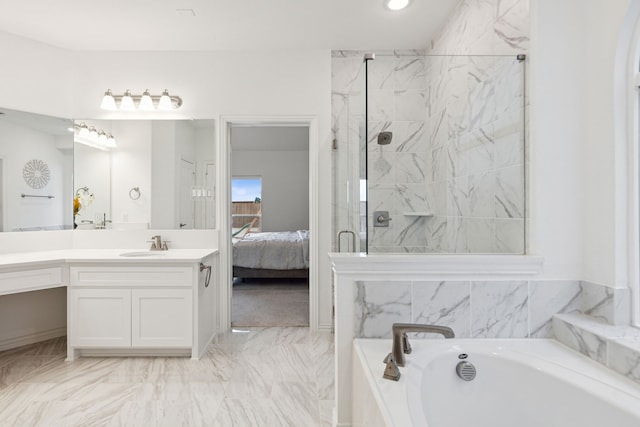 bathroom featuring vanity and separate shower and tub