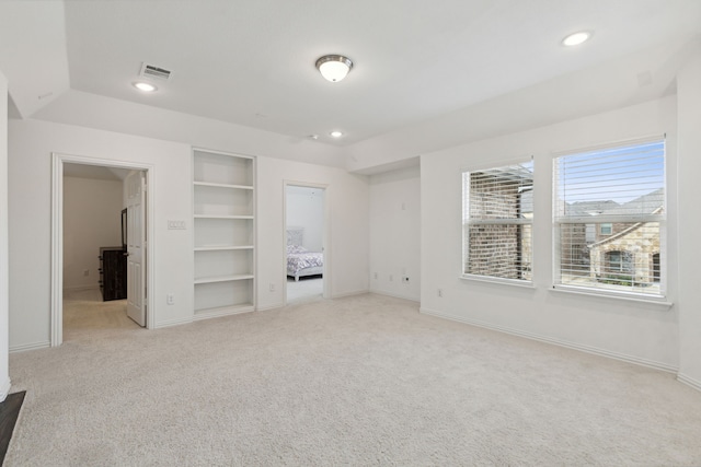 unfurnished bedroom with light colored carpet