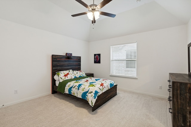 carpeted bedroom featuring vaulted ceiling and ceiling fan