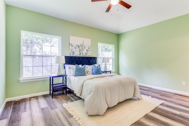 bedroom featuring wood-type flooring and ceiling fan