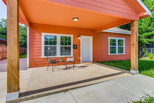 entrance to property with a patio