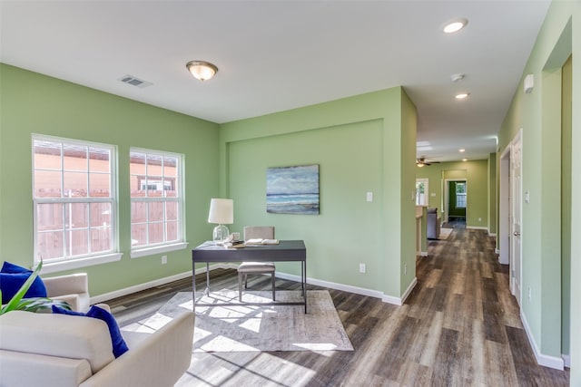 office featuring dark hardwood / wood-style floors and ceiling fan