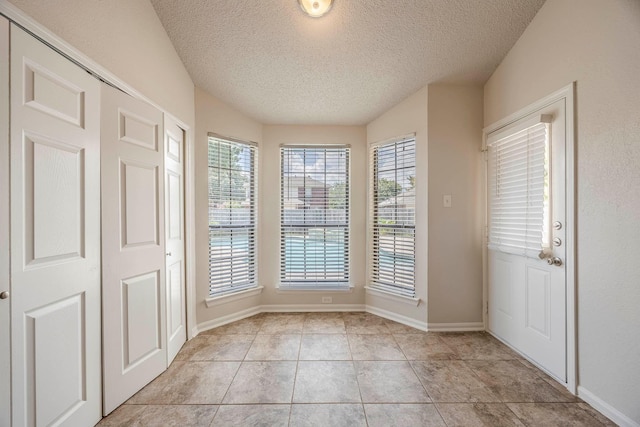 interior space featuring a textured ceiling