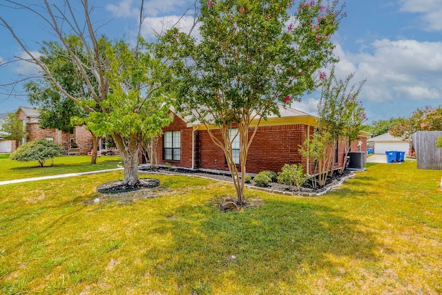 exterior space featuring a lawn and central AC