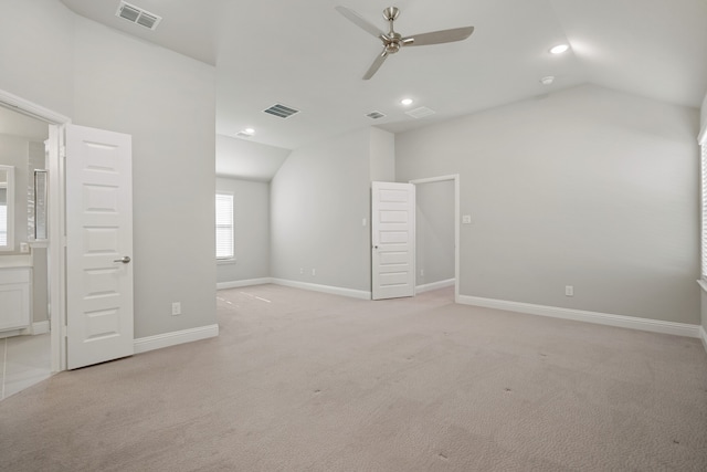 interior space with lofted ceiling and ceiling fan