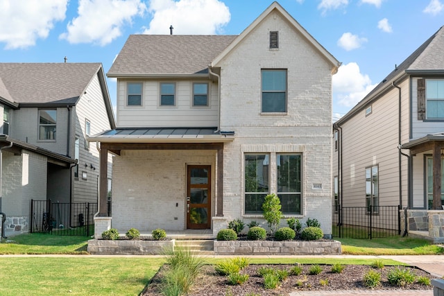 view of front of home featuring a front lawn