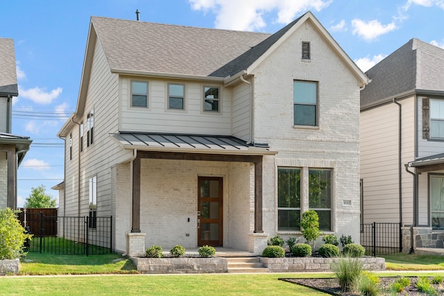 view of front of property featuring a porch and a front lawn