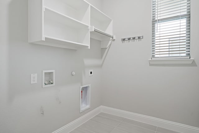 clothes washing area with washer hookup, tile patterned floors, hookup for a gas dryer, and electric dryer hookup