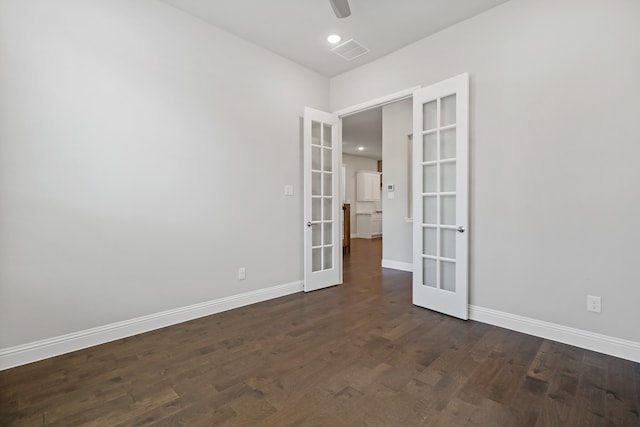 unfurnished room featuring french doors, dark hardwood / wood-style floors, and ceiling fan