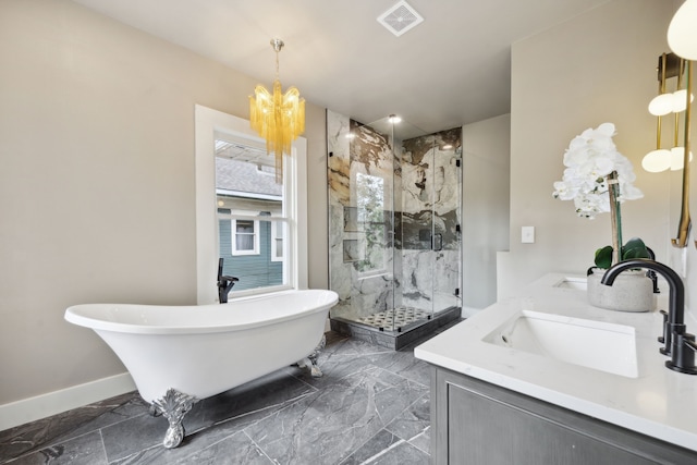 bathroom featuring vanity, independent shower and bath, and a chandelier