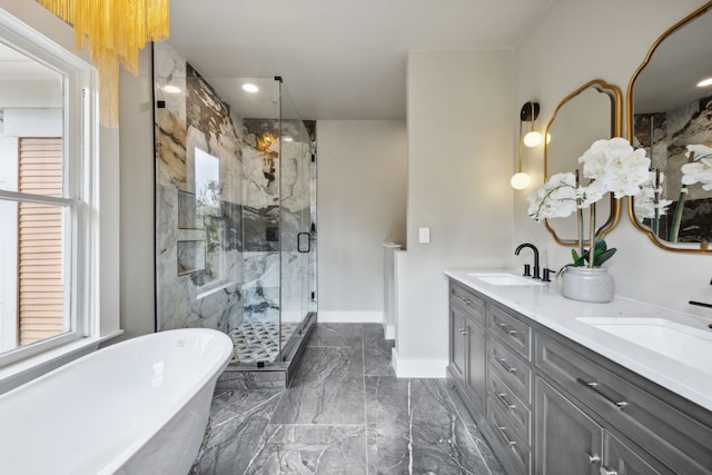 bathroom featuring vanity and separate shower and tub