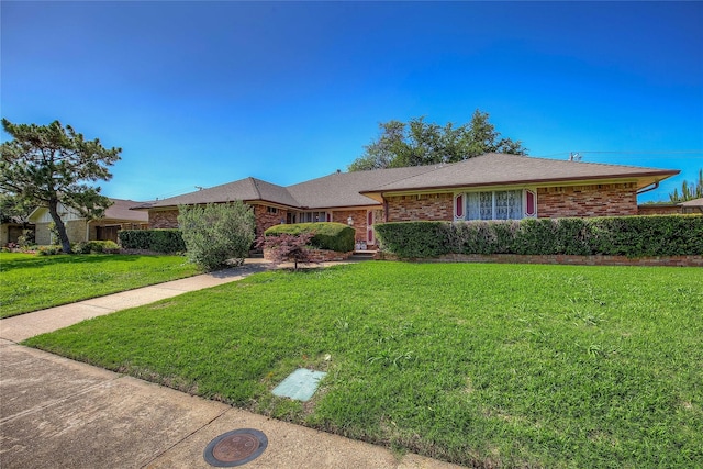 single story home featuring a front yard