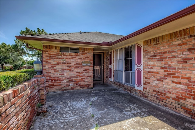 entrance to property with a patio