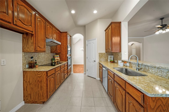 kitchen with decorative backsplash, appliances with stainless steel finishes, sink, and ceiling fan