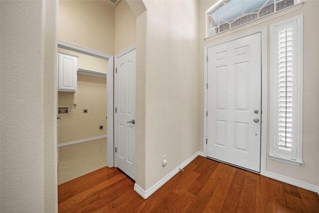 entrance foyer featuring hardwood / wood-style flooring and a healthy amount of sunlight