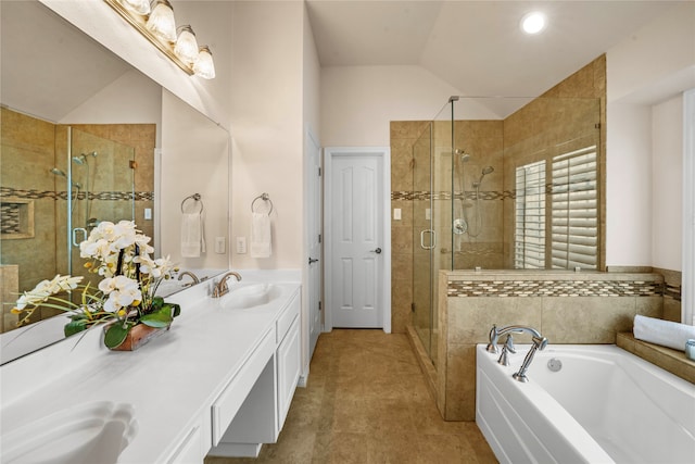 bathroom with lofted ceiling, shower with separate bathtub, tile patterned floors, and dual bowl vanity