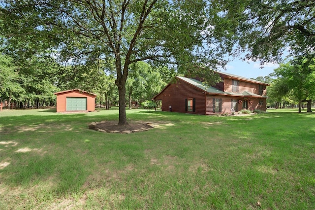 view of yard with a garage and an outdoor structure