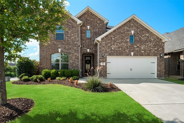 view of property with a garage and a front yard