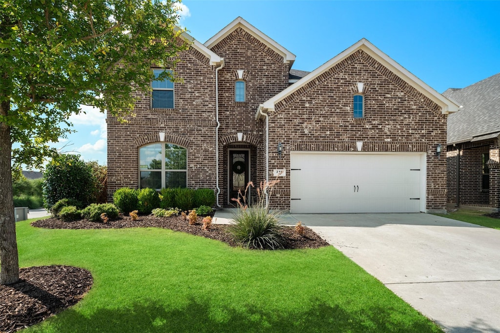 view of property with a garage and a front yard