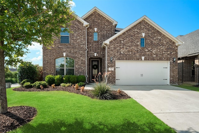 view of property with a garage and a front yard