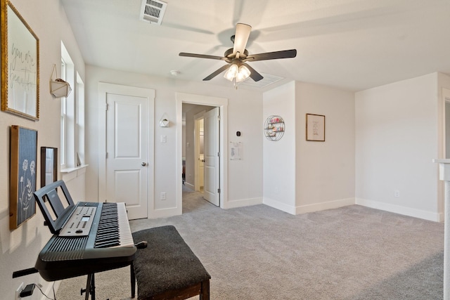 sitting room featuring ceiling fan and light colored carpet