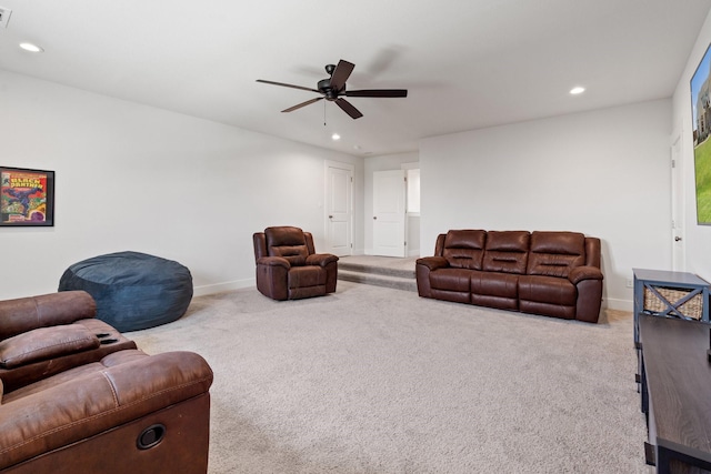 carpeted living room featuring ceiling fan