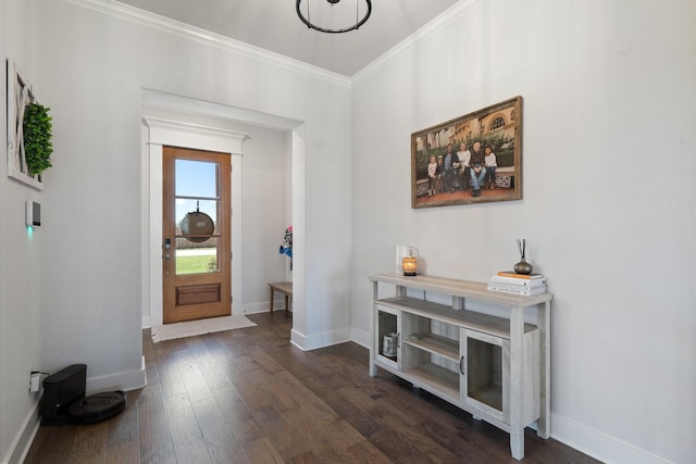 foyer entrance with crown molding and dark wood-type flooring