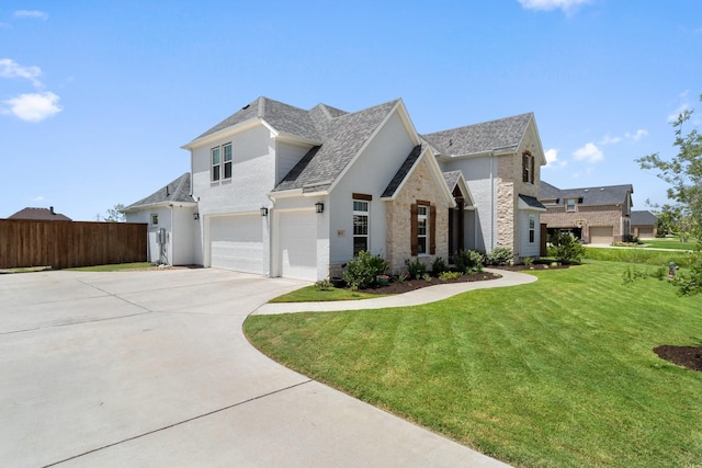 view of front of house with a garage and a front yard