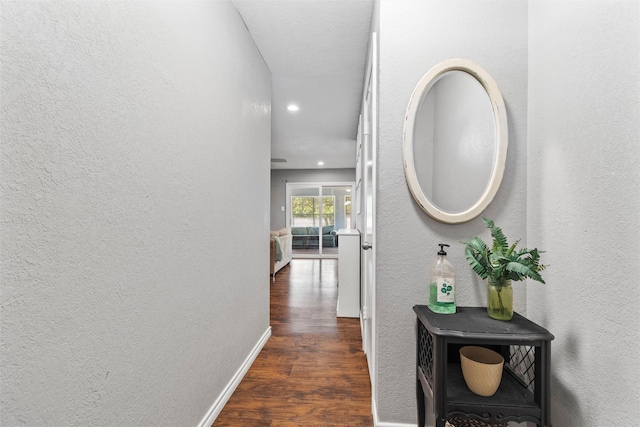 hallway with dark hardwood / wood-style floors