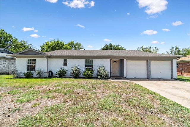 single story home with a garage and a front yard