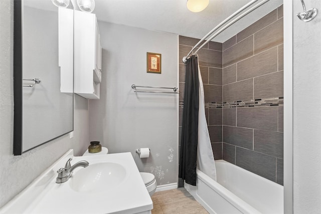 full bathroom with tile patterned flooring, toilet, shower / bath combination with curtain, and vanity