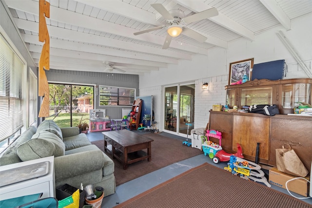 living room with beamed ceiling and ceiling fan