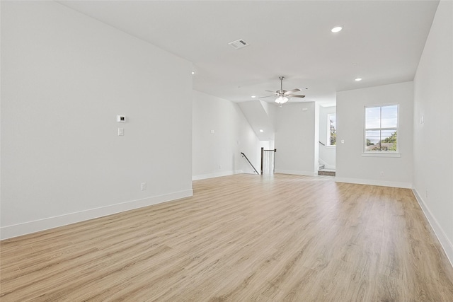 unfurnished living room with recessed lighting, ceiling fan, visible vents, light wood-style flooring, and baseboards