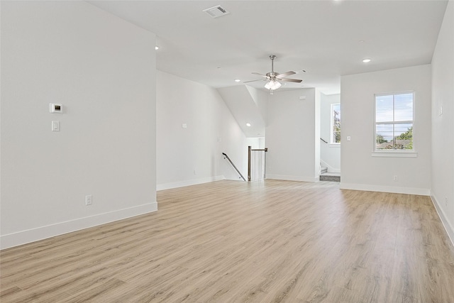 unfurnished living room featuring baseboards, visible vents, light wood-style flooring, and recessed lighting
