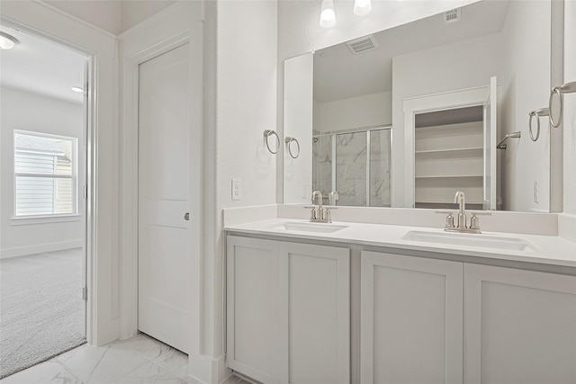 full bath featuring visible vents, marble finish floor, and a sink
