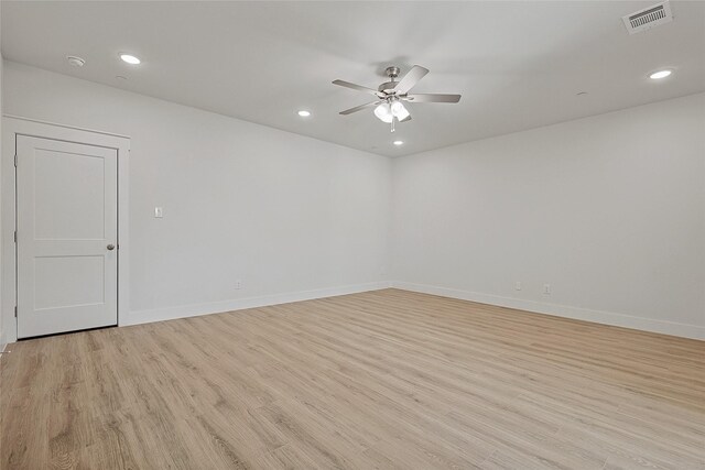 unfurnished room with recessed lighting, a ceiling fan, visible vents, and light wood-style flooring