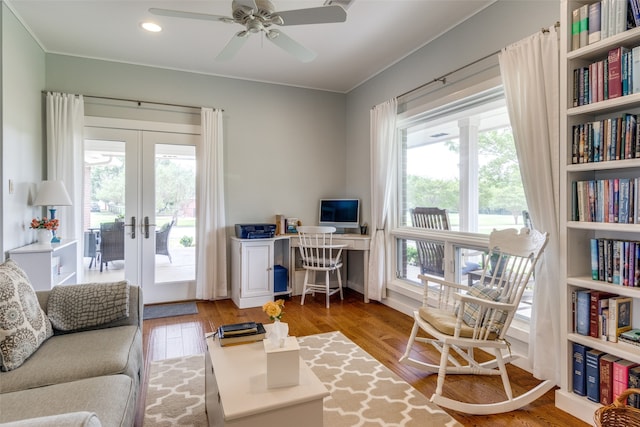 office with hardwood / wood-style flooring, ceiling fan, and french doors