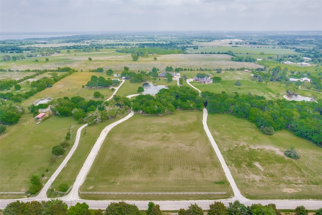 bird's eye view with a water view and a rural view