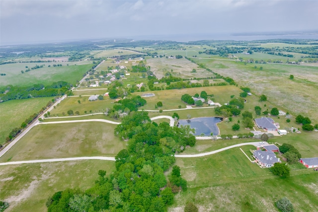 bird's eye view featuring a rural view and a water view