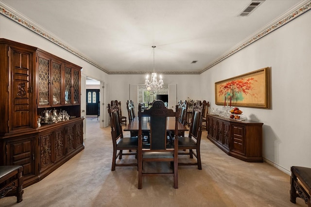 dining area featuring light carpet, ornamental molding, and a notable chandelier