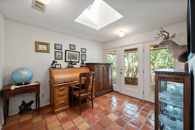 office with tile patterned flooring, french doors, a skylight, and ornamental molding