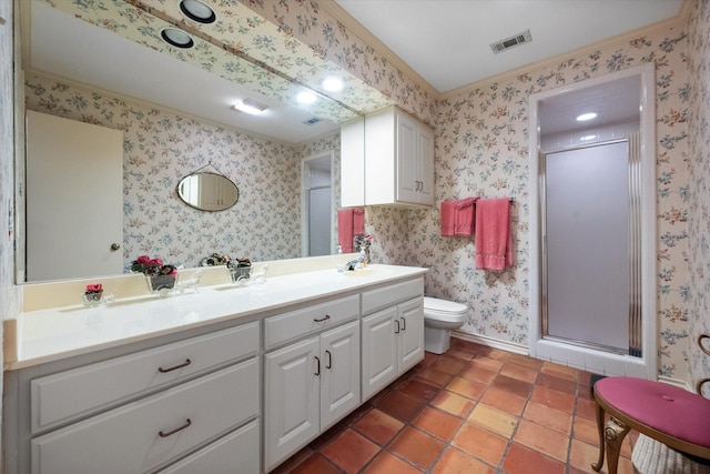 bathroom with tile patterned flooring, vanity, toilet, and a shower with door